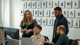 Image showing impromptu team collaboration meeting in GuyKat office