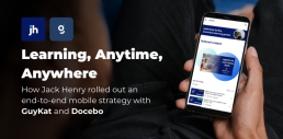 Close-up of a person holding a smartphone showing a learning portal; headline text reads “Learning, Anytime, Anywhere” with logos for Jack Henry and GuyKat, and subtext about rolling out an end-to-end mobile strategy with Docebo.